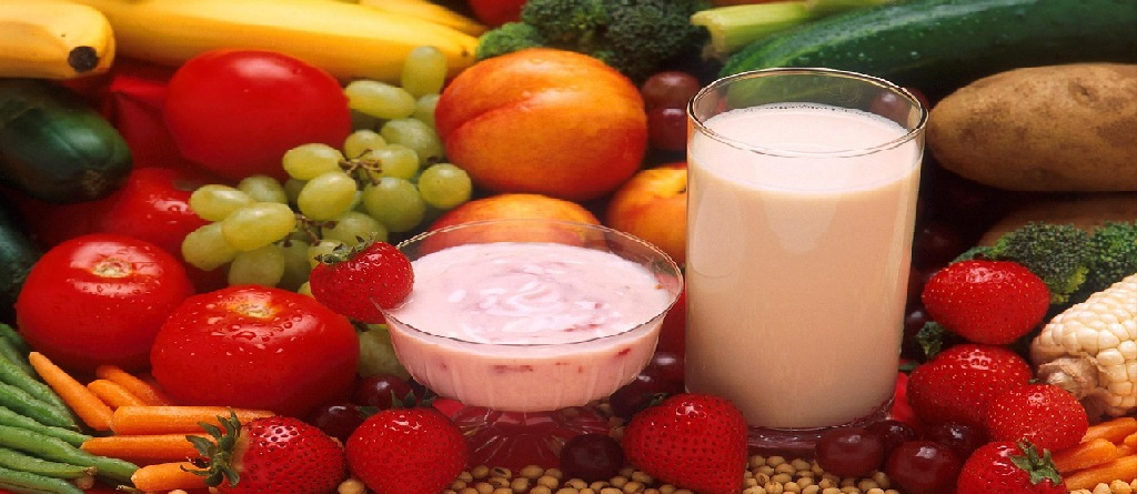 yogurt in glass and assorted fruits